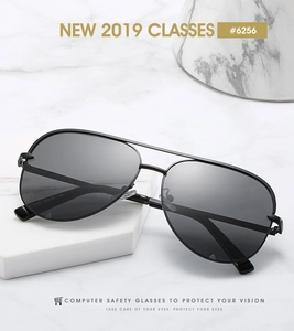 Macro view of black metal aviator frames with computer safety lenses and engraved model code