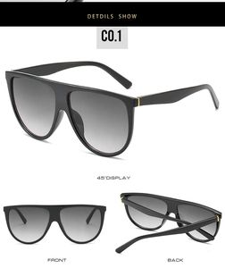 Vue détaillée de lunettes de soleil oversize à sommet plat avec monture noire et dorée