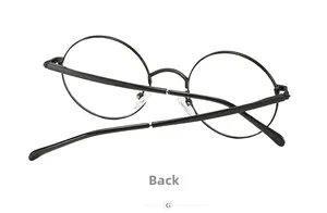 Vue arrière détaillée des lunettes rondes vintage en métal noir montrant la charnière et le pont