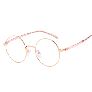 Monture de lunettes ronde rétro en métal or rose avec embouts rose clair