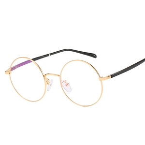 Lunettes rétro rondes en métal doré avec branches noires, monture optique au style épuré