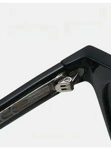 Macro shot of durable silver metal hinges and CE marks on black sunglasses temples