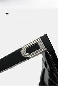Detail of silver hinge on black double-bridge aviator sunglasses with elastic material