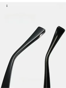 Macro detail of glossy black curved temple tips for comfortable ergonomic eyewear fit