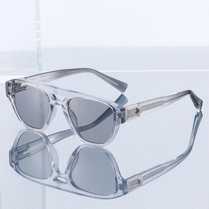 Modern transparent grey aviator sunglasses with silver metal trim and dark lenses