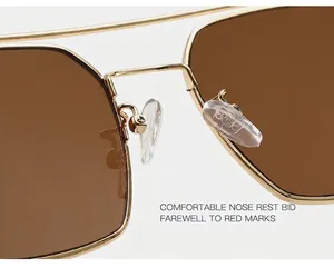 Macro shot of comfortable silicone nose pads on gold metal frame rectangular sunglasses