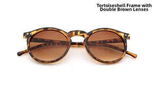 Detail of tortoiseshell round sunglasses with brown gradient lenses and metal rivet accents
