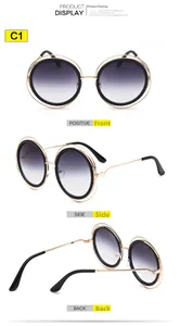 Vues détaillées de lunettes de soleil rondes en métal doré avec verres dégradés gris