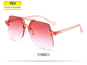 Side view of rimless pentagon sunglasses with red gradient lenses and pink frames