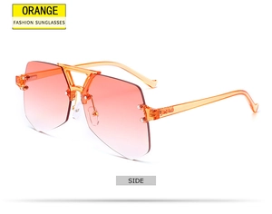 Side view of rimless orange gradient sunglasses with stylish geometric metal double bridge