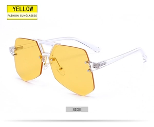 Side view of rimless yellow geometric sunglasses with transparent frames and gold accents