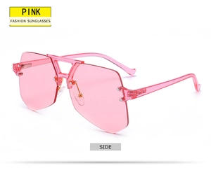 Side view of pink rimless oversized fashion sunglasses with transparent resin frames