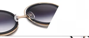 Détail de lunettes montrant des plaquettes de nez en silicone et un pont en métal doré