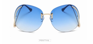 Vue détaillée de lunettes de soleil sans monture avec verres bleus et branches dorées