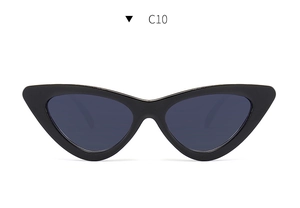Detail view of vintage black cat-eye sunglasses with dark lenses and sharp triangular frame