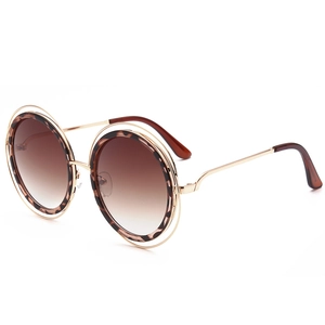 Lunettes de soleil rondes rétro avec monture dorée et finition léopard en écaille