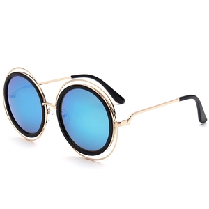 Lunettes de soleil rondes oversize pour femmes avec verres miroir bleus et monture dorée