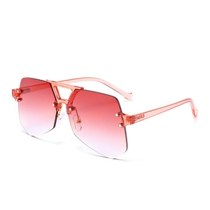 Modern rimless irregular sunglasses with red gradient lenses and transparent pink frames