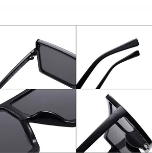 Detail view of square oversized sunglasses showing metal hinges and molded nose pads