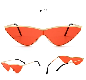 Three-angle views of cat-eye sunglasses with gold metal frames and translucent red lenses