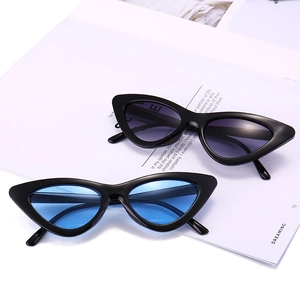 Vintage cat eye triangle sunglasses with black frames and gradient lenses for women