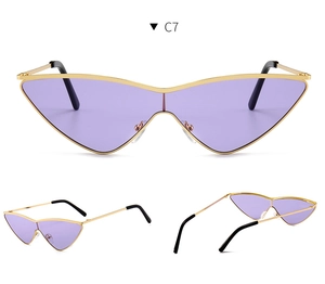 Detailed view of fashion cat-eye sunglasses with purple lenses and gold metal frames