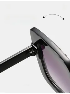 Makro-Detail des robusten Scharniers an der schwarzen quadratischen Sonnenbrille