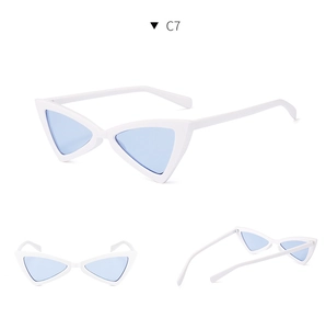Macro details of vintage white cat-eye sunglasses with light blue translucent lenses