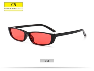 Side view of small rectangular sunglasses with black frame and red lenses C5