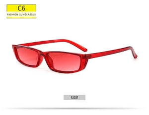 Side view of trendy small rectangular sunglasses with translucent red frame and lenses