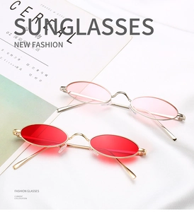 Détail de lunettes de soleil ovales rétro avec monture fine et verres colorés