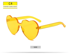 Vue latérale de lunettes de soleil sans monture en forme de cœur orange translucide