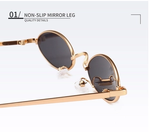 Détails des lunettes de soleil dorées avec branches antidérapantes et plaquettes