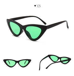 Retro cat eye sunglasses with black frames and vibrant green lenses in multiple views