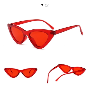 Macro view of transparent red cat-eye sunglasses with sleek temple and nose pad details
