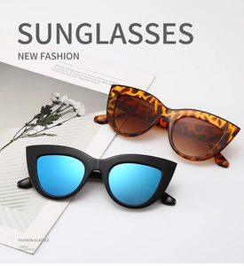 Detail of vintage cat-eye sunglasses with black blue lenses and tortoiseshell frame