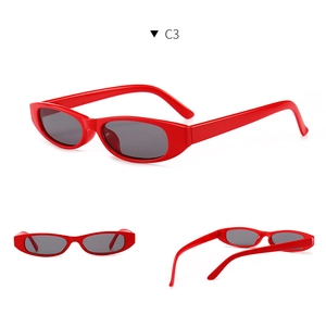 Detailed views of red vintage oval sunglasses showing frame curves and grey lenses