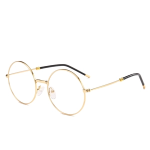 Lunettes rondes vintage avec monture en métal doré et embouts de branches noirs