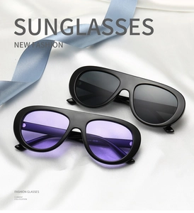 Detail of oversized sunglasses showing UV400 protection and CE certification on the temple