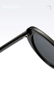 Macro view of firm metal hinges and quality details on black fashion sunglasses