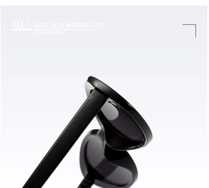 Detail of high-quality non-slip mirror legs and sturdy hinge on oval black sunglasses