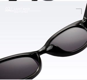 Macro detail of high-quality ergonomic nose pads on sleek black oval sunglasses