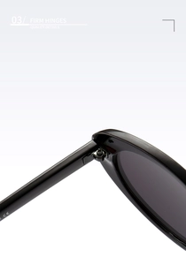 Detail of firm hinges and CE mark on black oval small frame sunglasses