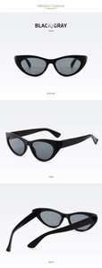 Three-dimensional view of black cat-eye sunglasses with UV400 protection markings