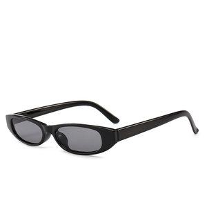Retro slim oval sunglasses in sleek black finish with dark lenses for a vintage look