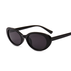 Classic retro black oval sunglasses with sleek ergonomic temples in 45-degree angle view