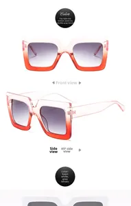 Detail view of square oversized sunglasses in gradient red and beige white frames