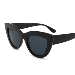 Retro oversized cat eye sunglasses with black frames and dark grey lenses for women