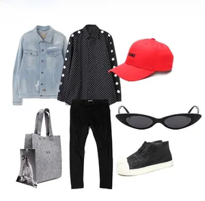 Flat lay of trendy outfit featuring cat eye sunglasses and casual denim streetwear set