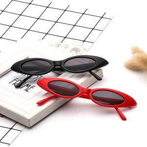 Retro slim cat eye sunglasses in black and red colors with glossy plastic frames